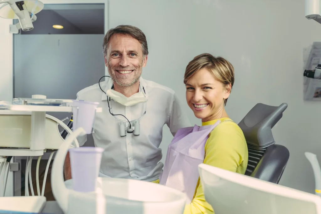 dentist and patient smiling